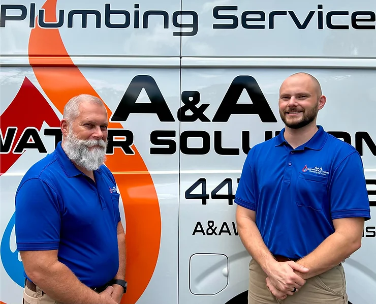 The image shows Alec and Anthony, the owners of AA Water Solutions, standing in front of their company van, which features their logo and branding.